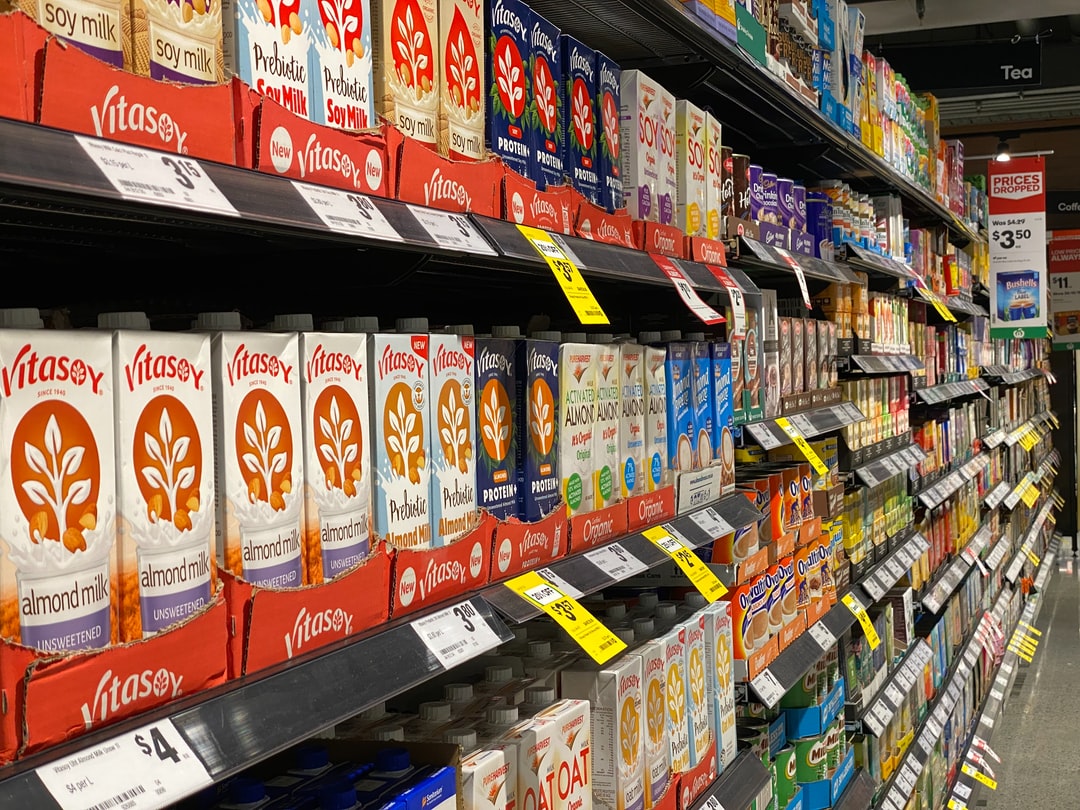 aisle, food, cheese, dairy refrigeration, cookies, biscuit, cereal, tea, coffee, yogurt, almond, rice, soy milk rice, spice, sauce, cereal, quick milk, store shelf shelf,  store, supermarket, supermarket aisle